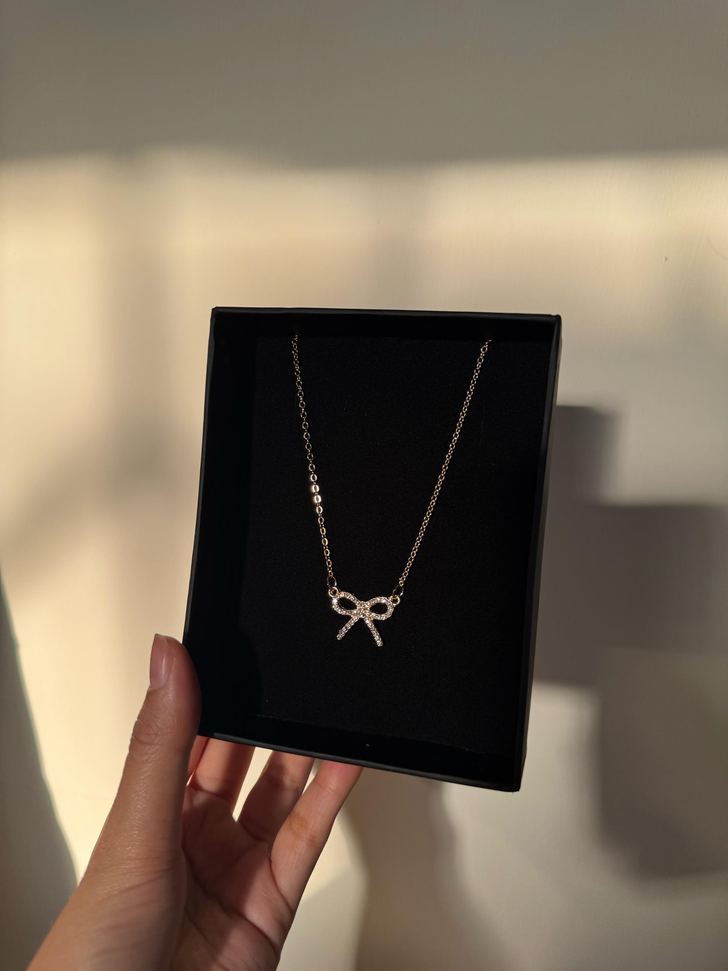 Elegant Gold Bow Necklace